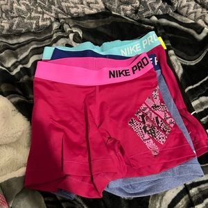 4pairs of Nike pro shorts